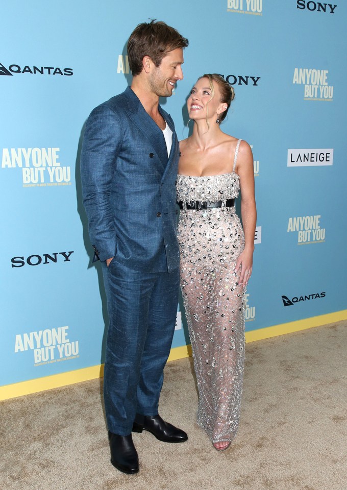 Glen Powell & Sydney Sweeney Smile on the ‘Anyone But You’ Carpet