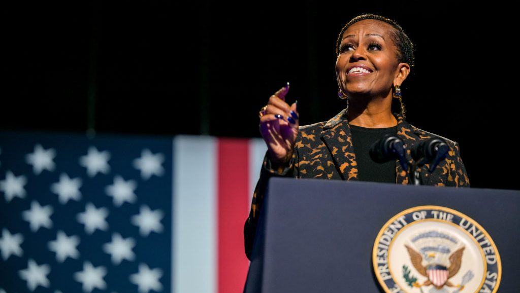 KALAMAZOO, MICHIGAN - OCTOBER 26: Former first lady Michelle Obama speaks ahead of the arrival of Democratic presidential nominee, U.S. Vice President Kamala Harris during a campaign rally at the Wings Event Center on October 26, 2024 in Kalamazoo, Michigan. Vice President Harris will be campaigning today with former first lady Michelle Obama in the battleground swing state of Michigan. With 10 days remaining, Harris continues campaigning against Republican presidential nominee, former U.S. President Donald Trump ahead of the November 5 election.  (Photo by Brandon Bell/Getty Images)