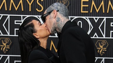 Kourtney Kardashian and Travis Barker kissing at the Emmys
