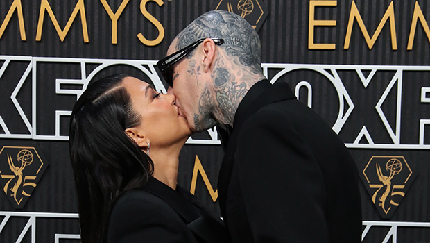 Kourtney Kardashian and Travis Barker kissing at the Emmys