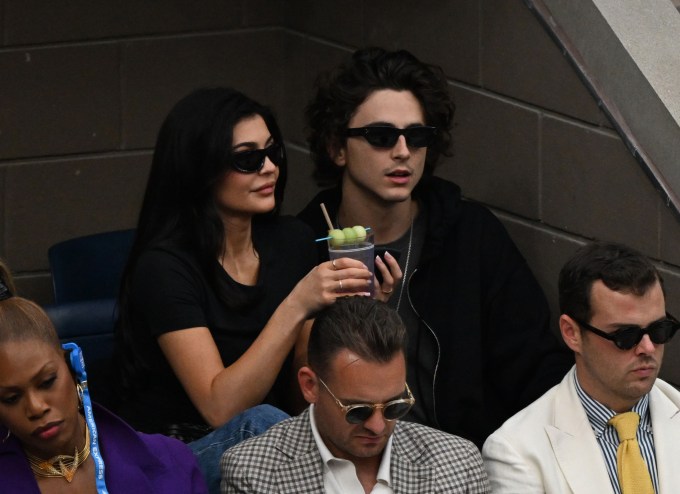 Kylie Jenner enjoys a drink at the US Open with Timothée Chalamet