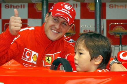German Formula 1 World Champion Ferrari Driver Michael Schumacher Joins with a Young Japanese Boy As the Youngster His Tries Outhis Race Car Wednesday 08 October 2003 Michael Schumacher is in Tokio to Prepare For This Coming Sunday's Formula 1 Grand Prix Being Held at the Suzuka Ciruit in Tokio Japan Tokio
Motor Racing Formula 1 Michael Schumacher - Oct 2003