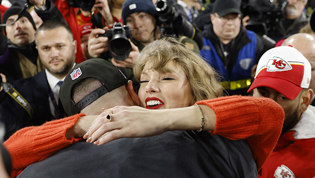 Taylor Swift hugging Travis Kelce