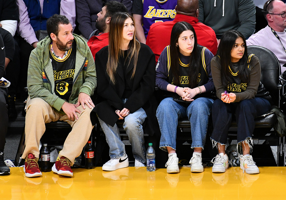 Adam Sandler and his family at a Lakers game