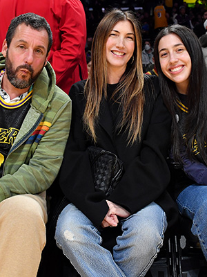 Adam Sandler with his wife and daughter Sadie at a Lakers game