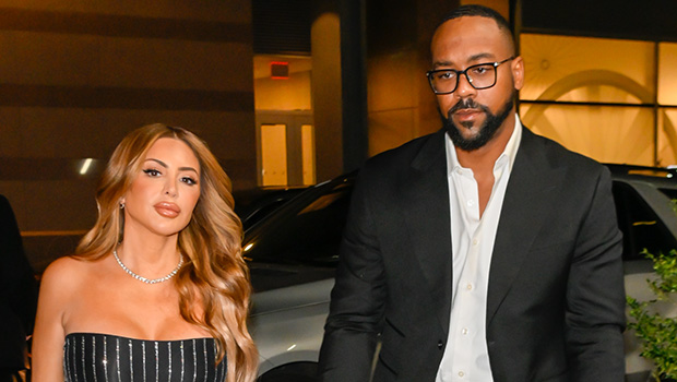 Larsa Pippen and Marcus Jordan holding hands