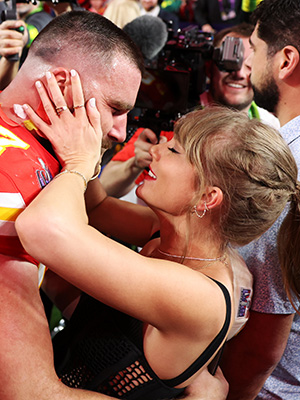 Travis Kelce and Taylor Swift kissing at the 2024 Super Bowl