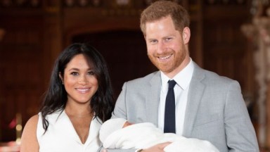 Meghan Markle and Prince Harry holding their son Archie