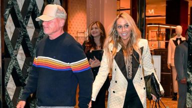 Dominic Purcell and wife Tish Cyrus holding hands