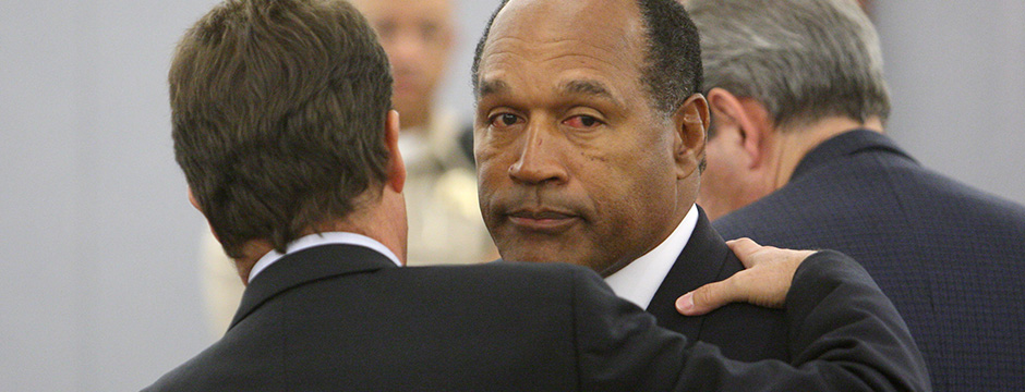 LAS VEGAS - OCTOBER 3:  O.J. Simpson (R) and his Defense Attorney Yale Galanter (L) embrace after a guilty verdict was read during his trial at the Clark County Regional Justice Center on October 3, 2008 in Las Vegas, Nevada. Simpson and co-defendant Clarence "C.J." Stewart were found guilty on all charges after standing trial for crimes including felony kidnapping, armed robbery and conspiracy related to a 2007 confrontation with sports memorabilia dealers in a Las Vegas hotel. The verdict comes 13 years to the day after Simpson was acquitted of murdering his ex-wife Nicole Brown Simpson and Ronald Goldman.  (Photo by Steve Marcus-Pool/Getty Images)