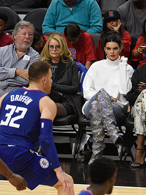 Blake Griffin playing basketball while Kendall Jenner watches