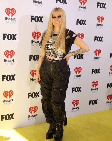 HOLLYWOOD, CALIFORNIA - APRIL 01: Avril Lavigne attends the 2024 iHeartRadio Music Awards  at Dolby Theatre on April 01, 2024 in Hollywood, California. (Photo by Aliah Anderson/WireImage)