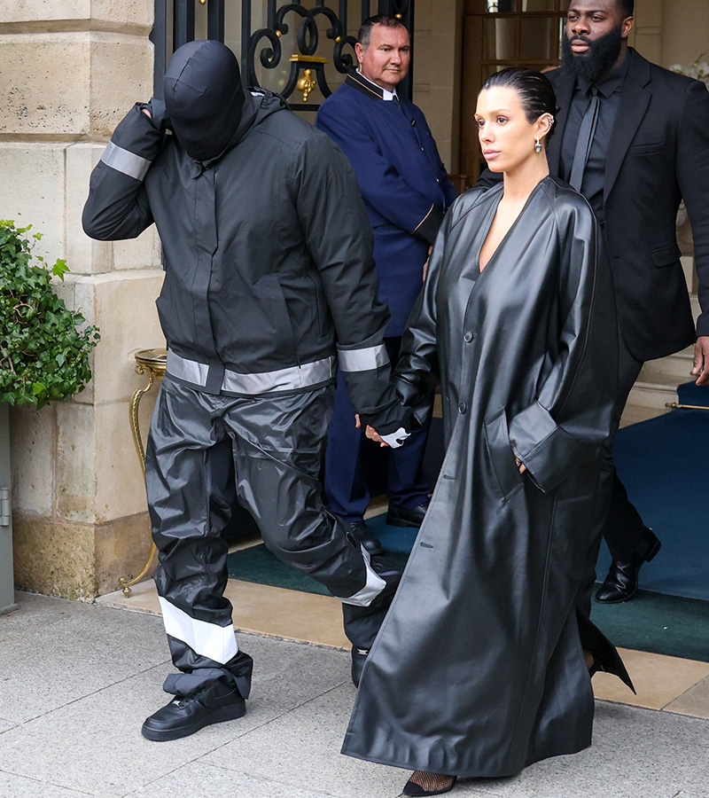 Kanye West and Bianca Censori walking out of a hotel