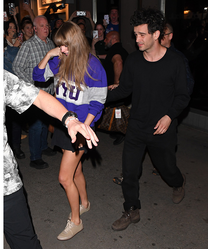 Taylor Swift and Matty Healy walking together 