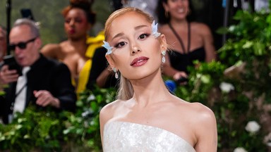 Ariana Grande posing in a white gown at the 2024 Met Gala