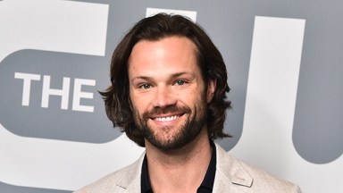 Jared Padalecki in front of The CW red carpet