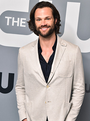Jared Padalecki in front of The CW red carpet