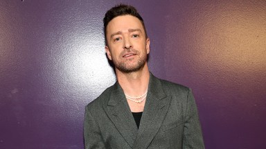 Justin Timberlake leaning against a purple wall