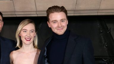 James McArdle (left), Saoirse Ronan, and Jack Lowden arriving at the Scottish premiere of Mary Queen of Scots at Edinburgh Castle. (Photo by Jane Barlow/PA Images via Getty Images)