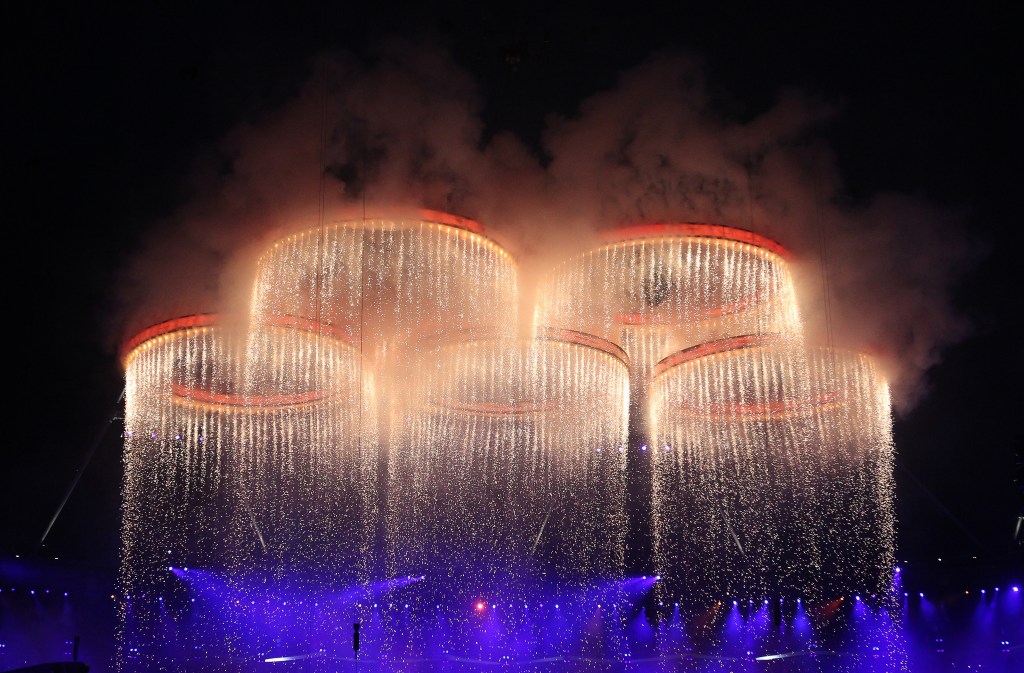 LONDON, ENGLAND - JULY 27: The Olympic Rings are seen rising during the Opening Ceremony of the London 2012 Olympic Games, directed by Danny Boyle, London spent an estimated £27m, the London opening ceremony was immediately seen as a tremendous success, widely praised as a "masterpiece" and "a love letter to Britain" at the Olympic Stadium on July 27, 2012 in London, England. (Photo by Ian MacNicol/Getty Images)