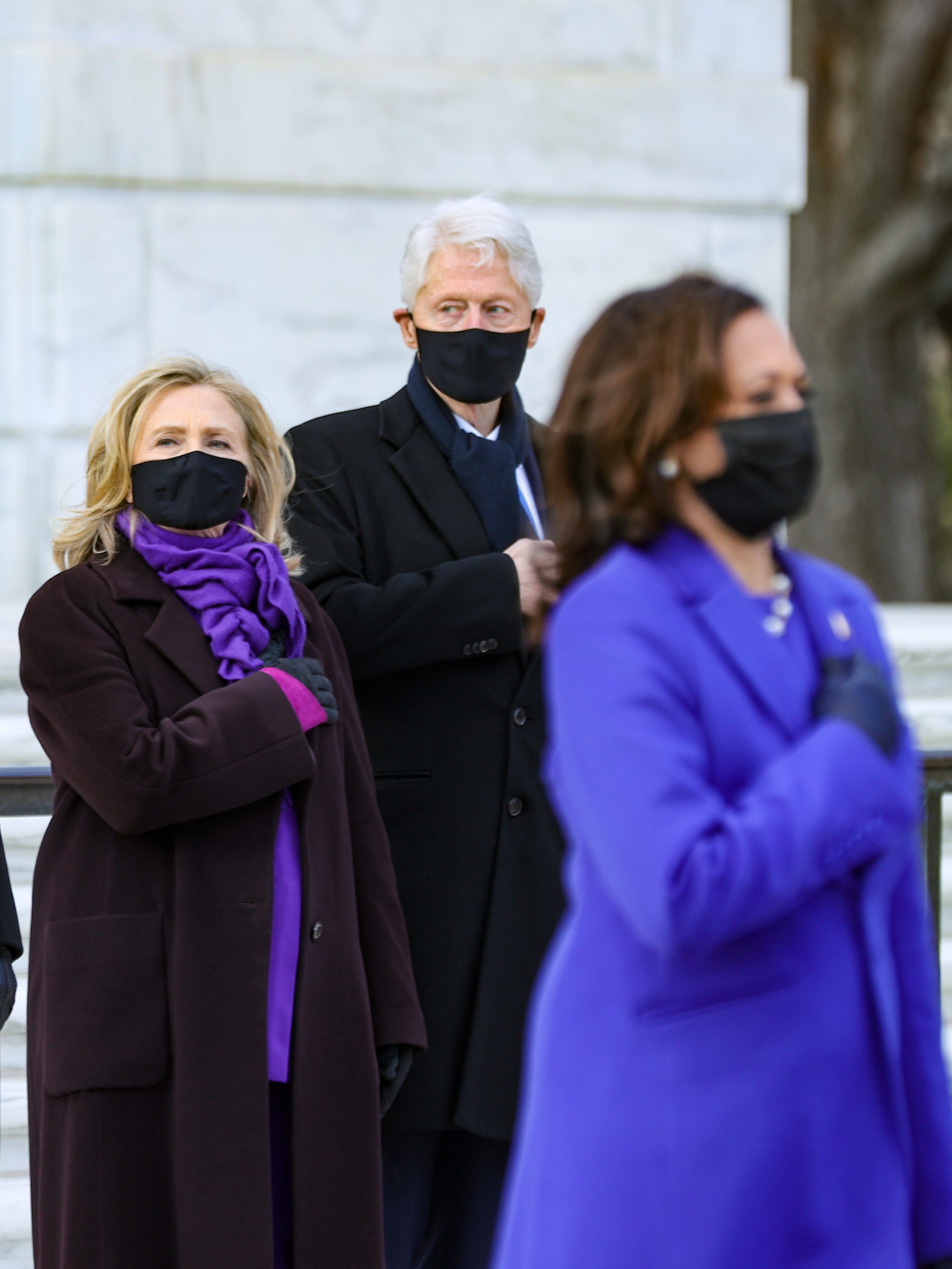 ARLINGTON, VA - JANUARY 20:   U.S. President Joe Biden and Vice President Kamala Harris attend a wreath-laying ceremony at Arlington National Cemetery's Tomb of the Unknown Soldier after the 59th Presidential Inauguration ceremony at the U.S. Capitol, as former U.S. President George W. Bush and Laura Bush, and former U.S. President Bill Clinton and former Secretary of State Hillary Clinton look on,  January 20, 2021  in Arlington, Virginia. During today's inauguration ceremony Joe Biden becomes the 46th president of the United States.   (Photo by Chip Somodevilla/Getty Images)