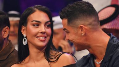 RIYADH, SAUDI ARABIA - OCTOBER 28: Cristiano Ronaldo and his wife Georgina Rodríguez speak ringside prior to the Heavyweight fight between Tyson Fury and Francis Ngannou at Boulevard Hall on October 28, 2023 in Riyadh, Saudi Arabia. (Photo by Justin Setterfield/Getty Images)