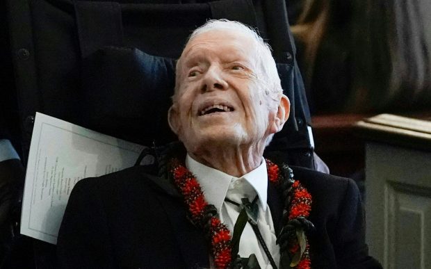 TOPSHOT - Former President Jimmy Carter departs after the funeral service for former first lady Rosalynn Carter at Maranatha Baptist Church, in Plains, Georgia, on November 29, 2023. Carter died on November 19, 2023, at the age of 96, just two days after joining her husband in hospice care at their house in Plains. (Photo by Alex Brandon / POOL / AFP) (Photo by ALEX BRANDON/POOL/AFP via Getty Images)