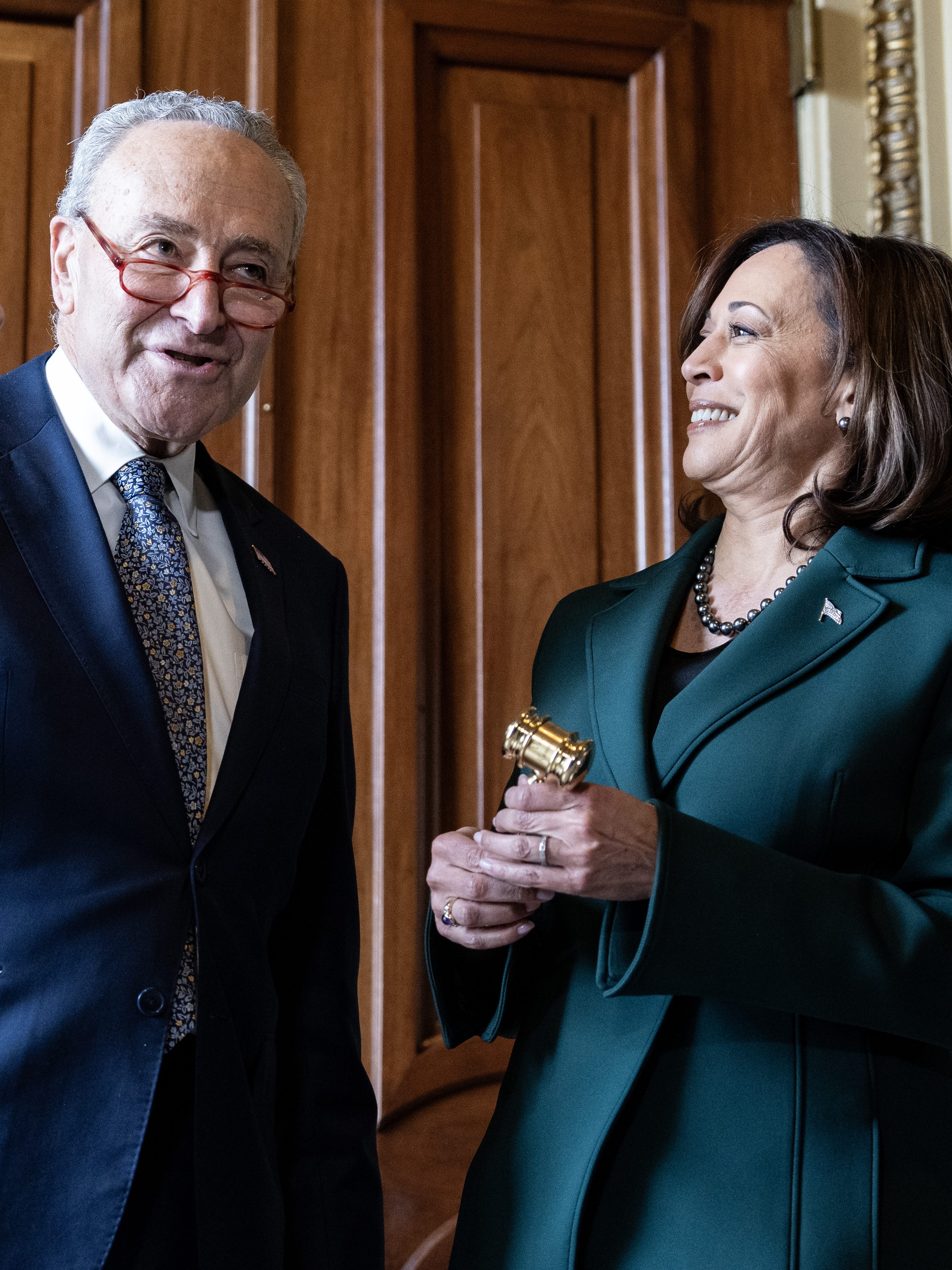 Chuck Schumer presents a golden gavel to Vice President Kamala Harris