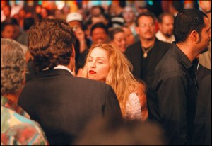 American attorney John F Kennedy Jr (1960 - 1999) (dark jacket, back to camera) and Pop singer Madonna (born Madonna Ciccone) talk together at the MGM Grand Garden Arena, Paradise, Nevada, June 28, 1997. They were there to attend the WBA Heavyweight Championship, a rematch between boxers Mike Tyson & Evander Holyfield. (Photo by Michael Brennan/Getty Images)