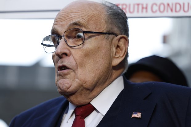WASHINGTON, DC - DECEMBER 15: Rudy Giuliani, the former personal lawyer for former U.S. President Donald Trump, speaks with reporters outside of the E. Barrett Prettyman U.S. District Courthouse after a verdict was reached in his defamation jury trial on December 15, 2023 in Washington, DC. A jury has ordered Giuliani to pay $148 million in damages to Fulton County election workers Ruby Freeman and Shaye Moss. (Photo by Anna Moneymaker/Getty Images)
