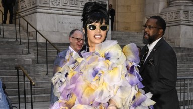 NEW YORK, NEW YORK - JULY 01: Cardi B is seen wearing a Marc Jacobs sheer ruffled outfit, yellow leggings and white Marc Jacobs shoes outside the Marc Jacobs show on July 01, 2024 in New York City. (Photo by Daniel Zuchnik/Getty Images)