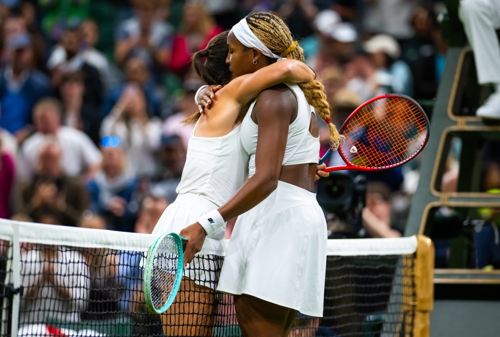 Emma Navarro of the United States and Coco Gauff of the United States embrace at the net at Wimbledon 2024 