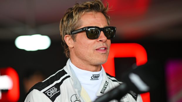 NORTHAMPTON, ENGLAND - JULY 04: Brad Pitt, star of the upcoming Formula One based movie, talks to the media in the Paddock during previews ahead of the F1 Grand Prix of Great Britain at Silverstone Circuit on July 04, 2024 in Northampton, England. (Photo by Rudy Carezzevoli/Getty Images)