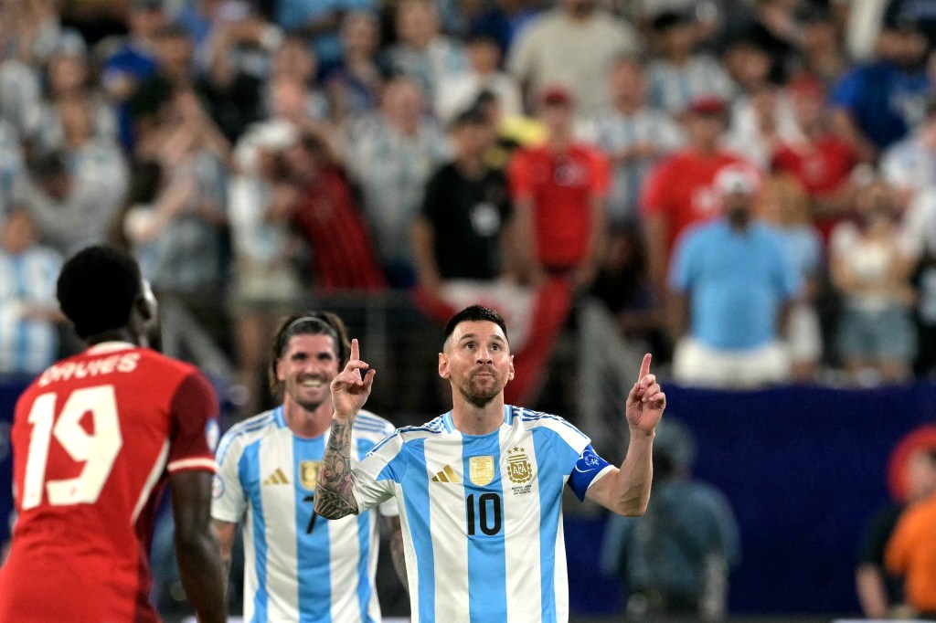 Argentina's forward #10 Lionel Messi celebrates scoring his team's second goal with teammates during the Conmebol 2024 Copa America tournament semi-final football match between Argentina and Canada at MetLife Stadium, in East Rutherford, New Jersey on July 9, 2024. (Photo by JUAN MABROMATA / AFP) (Photo by JUAN MABROMATA/AFP via Getty Images)