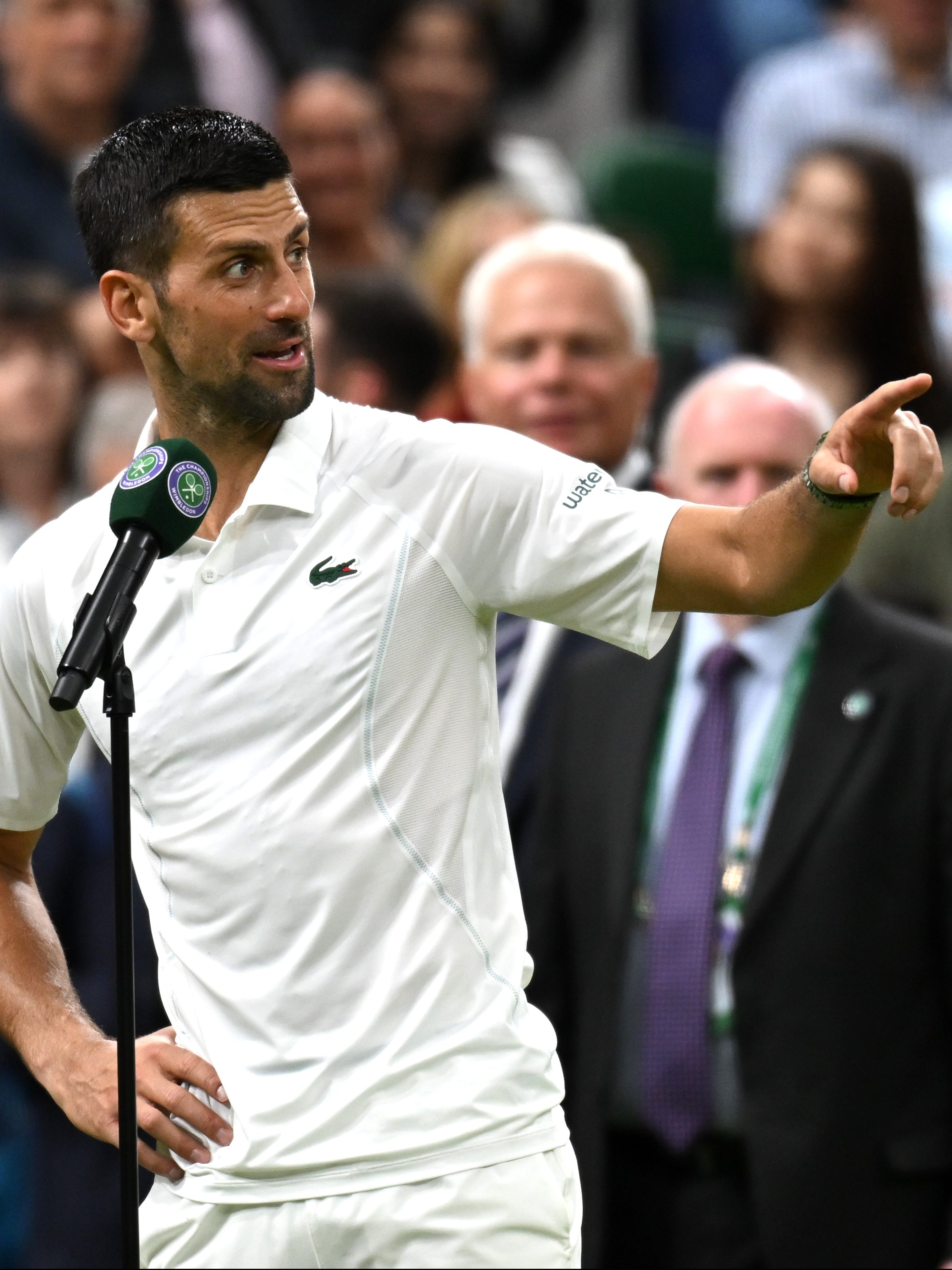 LONDON, ENGLAND - JULY 08: Novak Djokovic of Serbia addresses the crowd on Centre Court wishing them a 'good night' following victory against Holger Rune of Denmark in his Gentlemen's Singles fourth round match during day eight of The Championships Wimbledon 2024 at All England Lawn Tennis and Croquet Club on July 08, 2024 in London, England. (Photo by Mike Hewitt/Getty Images)