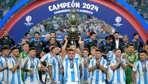 Argentina's forward #22 Lautaro Martinez lifts up the trophy as he celebrates winning the Conmebol 2024 Copa America tournament final football match between Argentina and Colombia at the Hard Rock Stadium, in Miami, Florida on July 14, 2024. (Photo by JUAN MABROMATA / AFP) (Photo by JUAN MABROMATA/AFP via Getty Images)