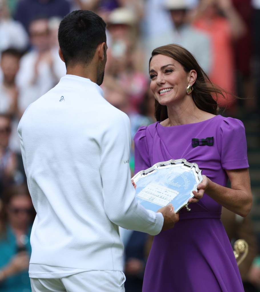 Catherine Princess of Wales presents the runner-up trophy to Novak Djokovic at Wimbledon 2024 