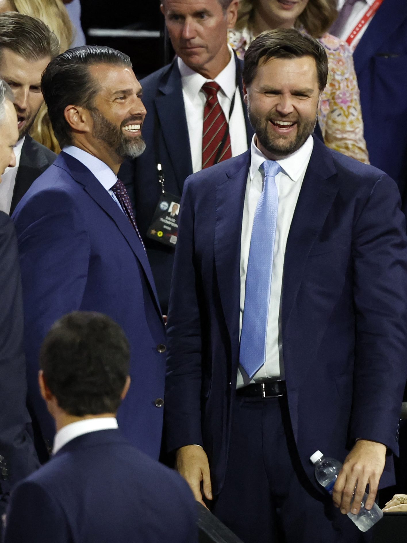 US Senator from Ohio and 2024 Republican vice-president candidate J. D. Vance (R) chats with Donald Trump Jr. (C) during the first day of the 2024 Republican National Convention at the Fiserv Forum in Milwaukee, Wisconsin, July 15, 2024. Donald Trump won formal nomination as the Republican presidential candidate and picked a right-wing loyalist for running mate, kicking off a triumphalist party convention in the wake of last weekend's failed assassination attempt. (Photo by KAMIL KRZACZYNSKI / AFP) (Photo by KAMIL KRZACZYNSKI/AFP via Getty Images)