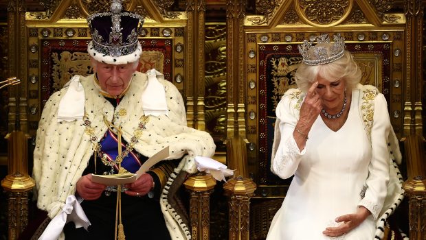 Britain's King Charles III, wearing the Imperial State Crown and the Robe of State, sits alongside Britain's Queen Camilla, wearing the George IV State Diadem, as he reads the King's Speech from the The Sovereign's Throne in the House of Lords chamber, during the State Opening of Parliament, at the Houses of Parliament, in London, on July 17, 2024. (Photo by HENRY NICHOLLS / POOL / AFP) (Photo by HENRY NICHOLLS/POOL/AFP via Getty Images)