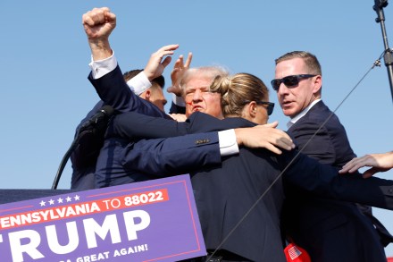  Republican presidential candidate former President Donald Trump is rushed offstage during a rally on July 13, 2024 in Butler, Pennsylvania. (Photo by Anna Moneymaker/Getty Images)