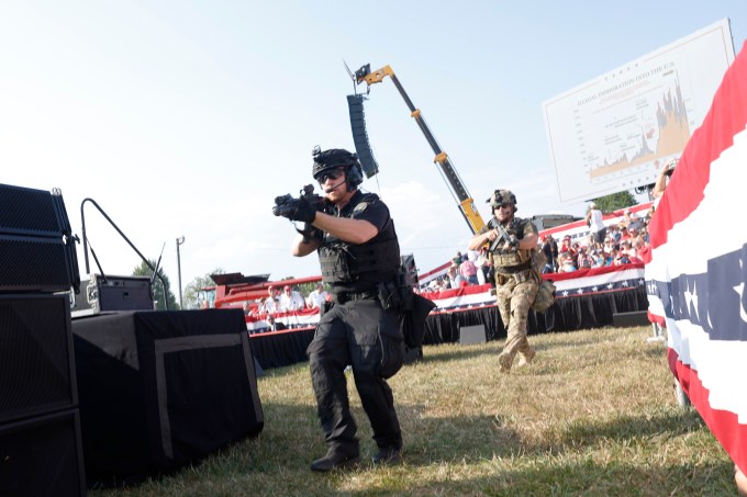 Law enforcement officers move during shooting at Donald Trump rally