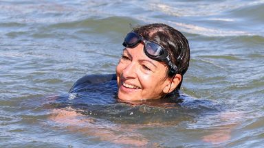 PARIS, FRANCE - JULY 17: Mayor of Paris Anne Hidalgo is seen swimming in the river Seine on July 17, 2024 in Paris, France. The city's mayor took a dip in the Seine amid concerns over water cleanliness ahead of the Olympic Games, in which the river will host triathlon and marathon swimming events. (Photo by Pierre Suu/Getty Images)