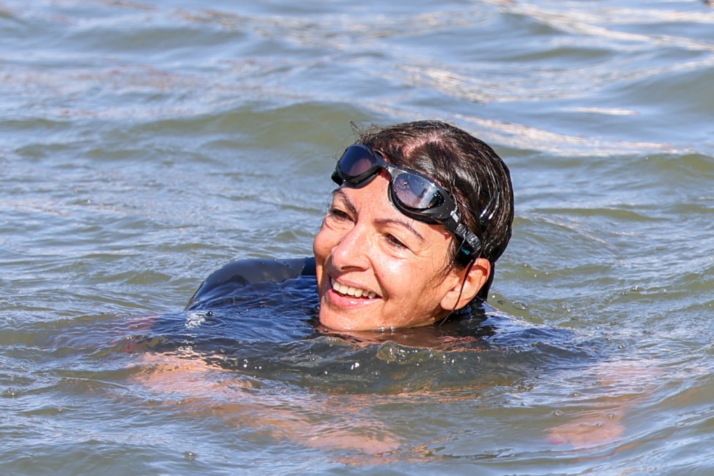 PARIS, FRANCE - JULY 17: Mayor of Paris Anne Hidalgo is seen swimming in the river Seine on July 17, 2024 in Paris, France. The city's mayor took a dip in the Seine amid concerns over water cleanliness ahead of the Olympic Games, in which the river will host triathlon and marathon swimming events. (Photo by Pierre Suu/Getty Images)