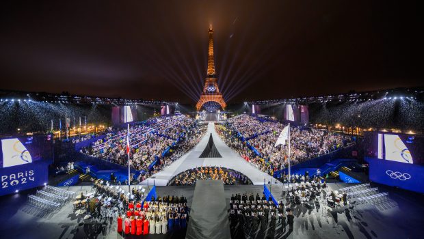 PARIS, FRANCE - JULY 26:  The Olympic flag is rasied at the Place du Trocadero in front of the Eiffel Tower during the Opening Ceremony of the Olympic Games Paris 2024 on July 26, 2024 in Paris, France. (Photo by François-Xavier Marit-Pool/Getty Images)