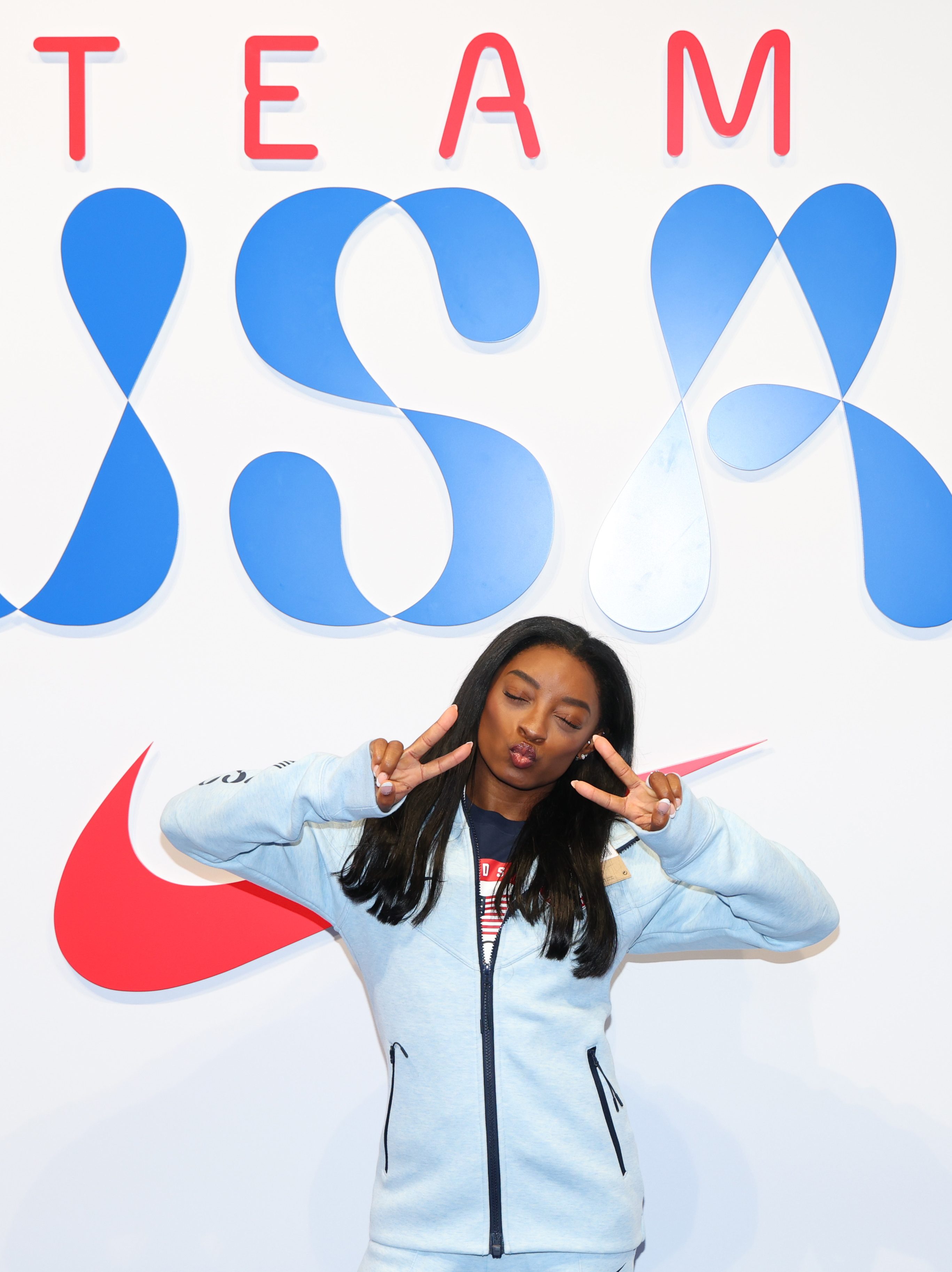 PARIS, FRANCE - JULY 22: Simone Biles tries on clothes at the Team USA Welcome Experience Ahead of Paris 2024 on July 22, 2024 in Paris, France.  (Photo by Joe Scarnici/Getty Images for USOPC)