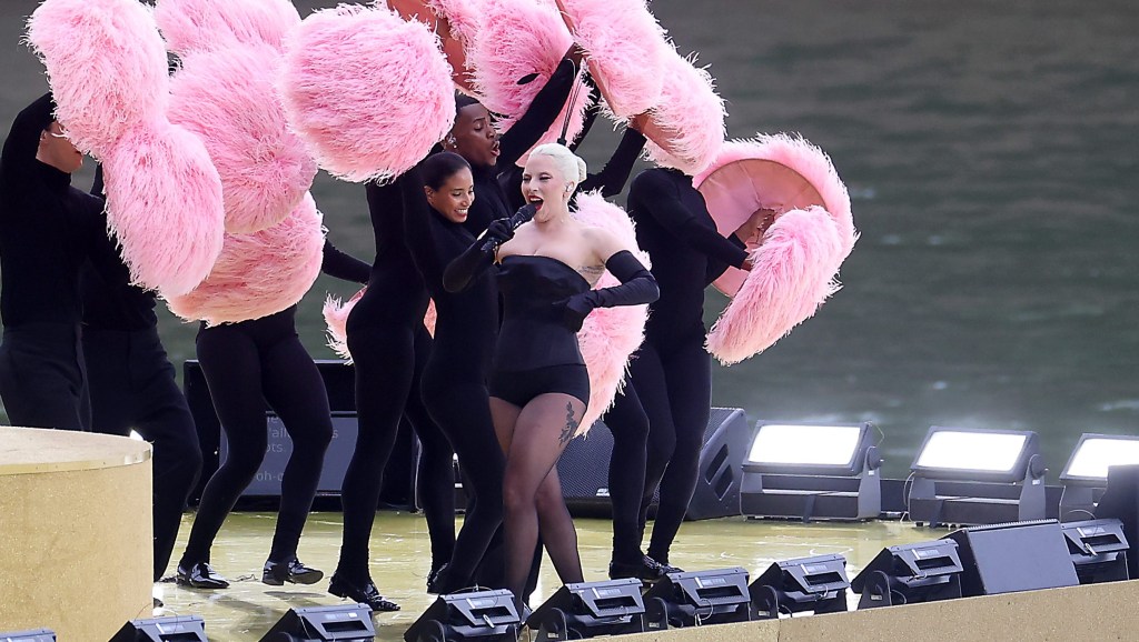 Lady Gaga performs at Square Barye during the athletes parade on the River Seine