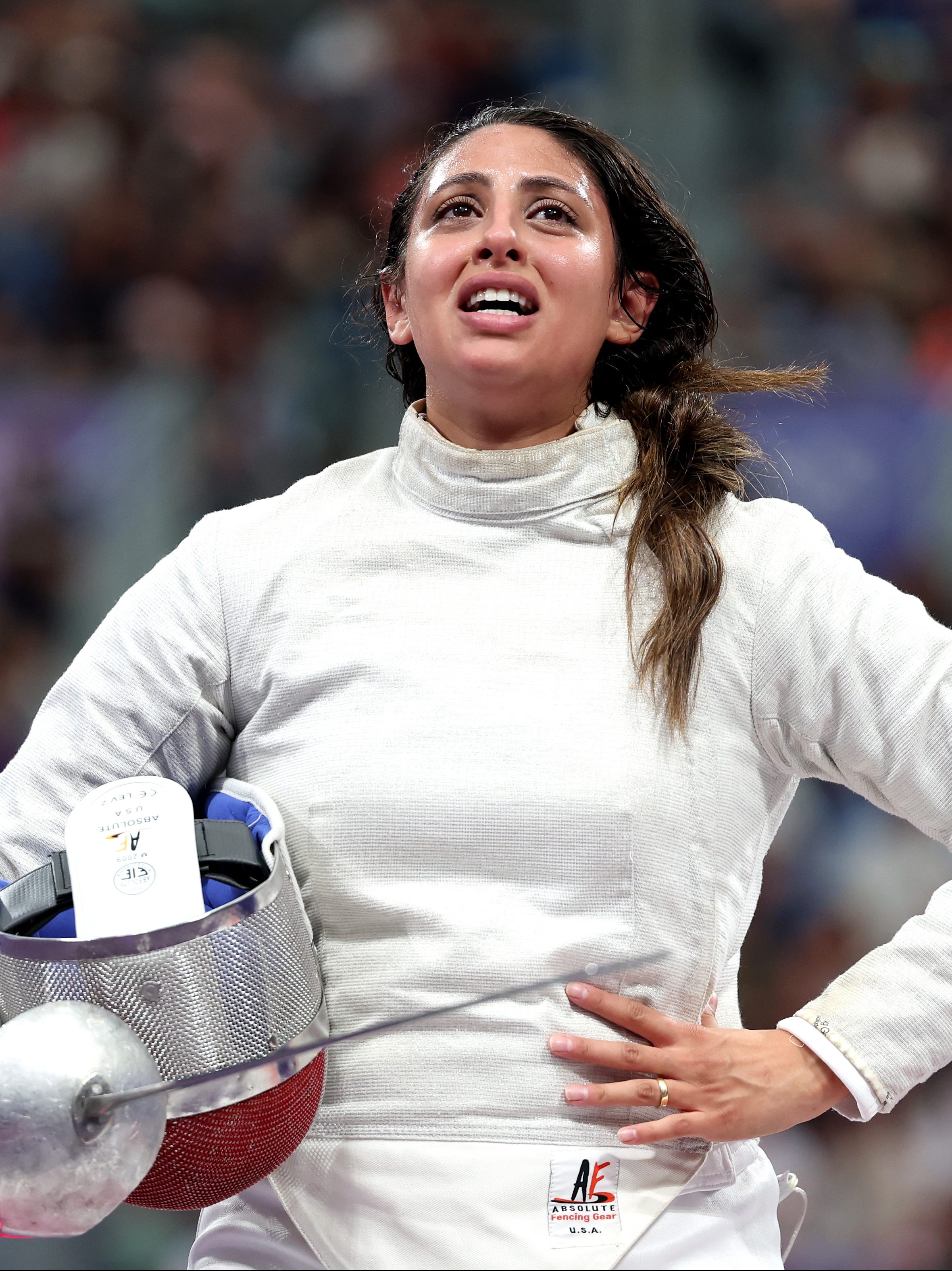 PARIS, FRANCE - JULY 29: Nada Hafez of Team Egypt shows emotion after her victory against Elizabeth Tartakovsky of Team United States (not pictured) in the Fencing Women's Sabre Individual Table of 32 on day three of the Olympic Games Paris 2024 at Grand Palais on July 29, 2024 in Paris, France. (Photo by Al Bello/Getty Images)
