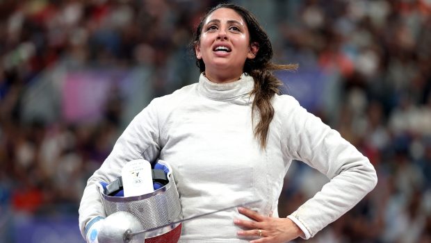 PARIS, FRANCE - JULY 29: Nada Hafez of Team Egypt shows emotion after her victory against Elizabeth Tartakovsky of Team United States (not pictured) in the Fencing Women's Sabre Individual Table of 32 on day three of the Olympic Games Paris 2024 at Grand Palais on July 29, 2024 in Paris, France. (Photo by Al Bello/Getty Images)