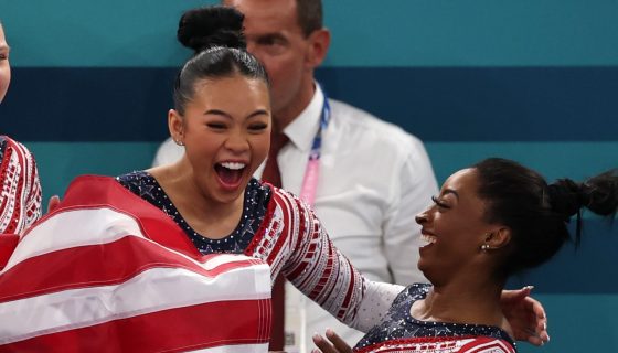 Sunisa Lee and Simone Biles of Team United States celebrate winning the gold medal