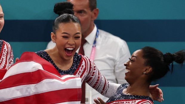 Sunisa Lee and Simone Biles of Team United States celebrate winning the gold medal